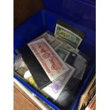 A tub of world coins and banknotes