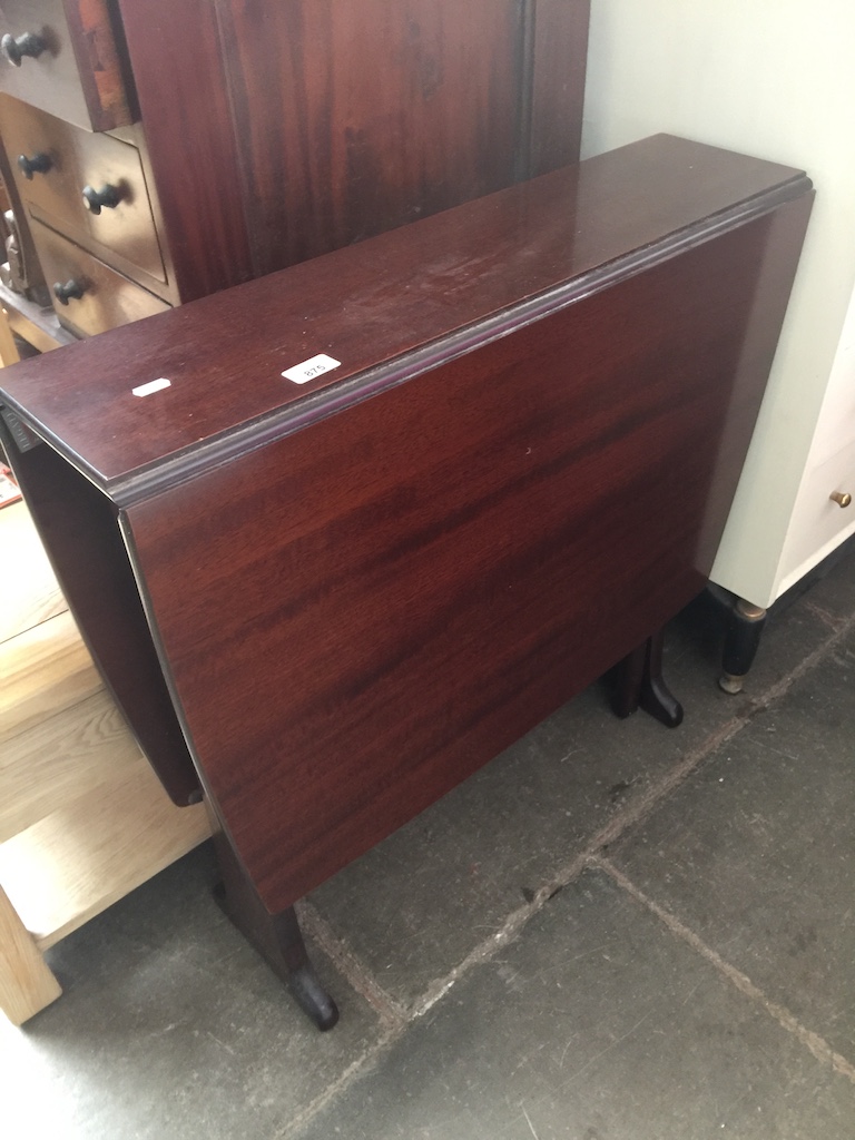 A mahogany drop leaf table