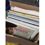 A box of record LPs