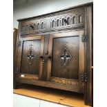 An oak priory style cupboard