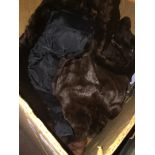 A box containing fur shawls