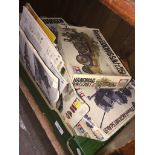 A box of vintage model kits, mainly WW 2 German models.