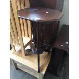 A mahogany octagonal tripod table