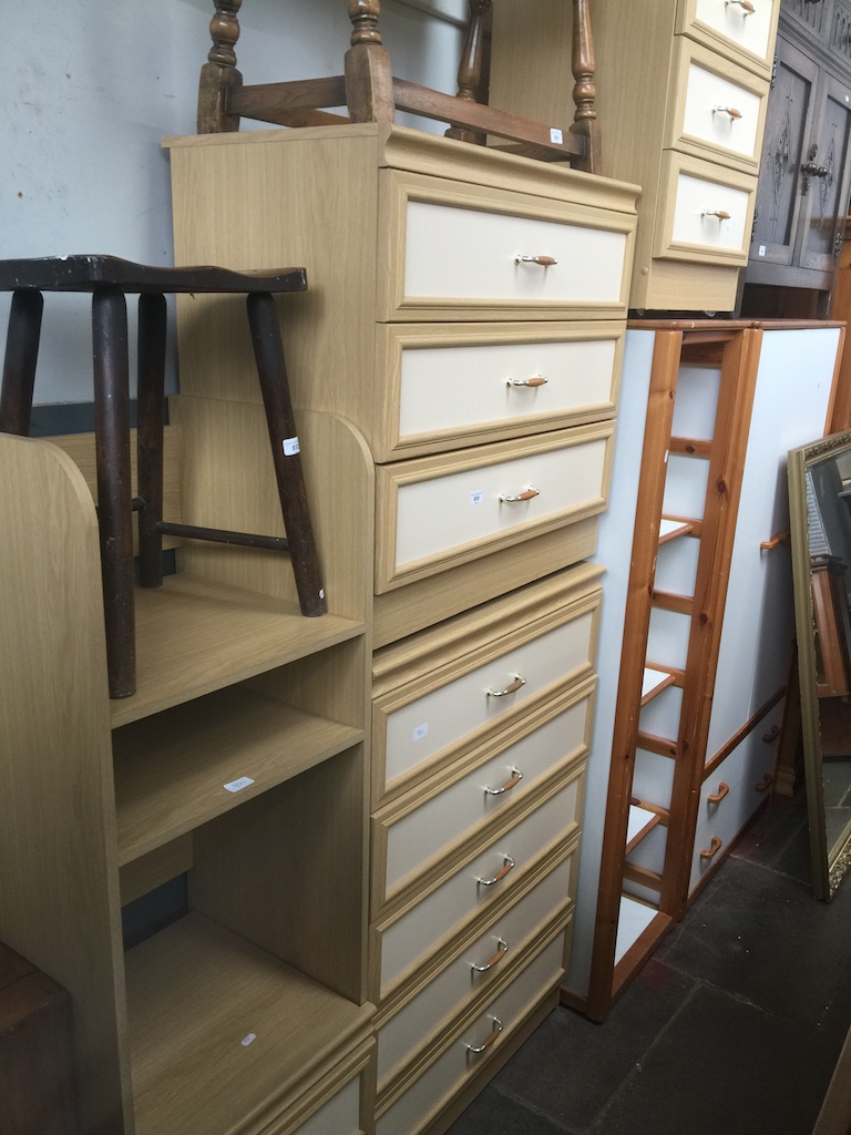 Two matching chests of drawers, a matching tall shelving unit and a matching bedside cabinet