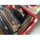A box of various LPs, 78s and 45s.