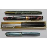 A group of three vintage fountain pens with 14ct gold nibs and a Parker.