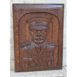 An oak panel carved in relief with a portrait depicting Lord Kitchener, early 20th century, 38cm x