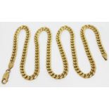 A curb link chain marked '14K', length 57cm, wt. 47.95g.