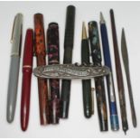 A mixed lot comprising five fountain pens with 14ct gold nibs, other pens and pencils and a