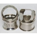 A group of four hallmarked silver serviette rings.