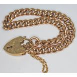 A hallmarked 9ct gold link bracelet with heart shaped clasp, length 18cm, wt. 21.62g.