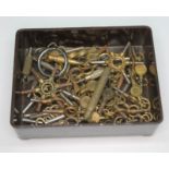 A tray of watch keys.