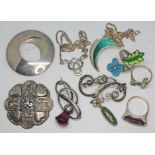 A mixed lot of silver and white metal jewellery comprising a French target brooch, a Charles