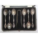 A cased set of six hallmarked silver teaspoons and sugar tongs.