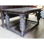 A Victorian carved oak refectory table with carved bulbouse legs and rectangular stretchers,