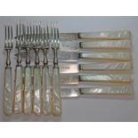 A set of 12 hallmarked silver and mother of pearl handle knives and forks.