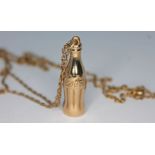 A novelty hallmarked 9ct gold pendant formed as a Coca Cola bottle length 30mm, on unmarked chain