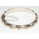 A hallmarked silver bamboo effect bangle, diam. approx. 5.8cm, wt. 14.25g.