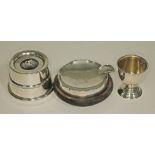 Three items hallmarked silver comprising an ink well, an ash tray and an egg cup.