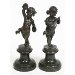 A pair of late 19th century bronze figures, one depicting a girl playing a lute and the other a