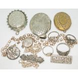 A mixed lot of silver and white metal including two large oval pendant lockets, various rings,