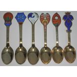 A set of six Danish silver gilt and enamel year spoons each with a different enamelled design and