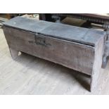 A 17th century boarded oak chest with strap iron work hinges and carved details, length 128cm, depth