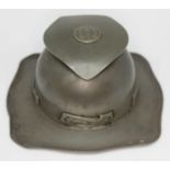 An Arts & Crafts pewter inkwell designed by Archibald Knox for Liberty & Co, unmarked.