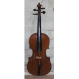 A Joseph Guarnerius copy violin with two piece back, length 36cm, bearing label to interior, with