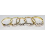 A group of five gold and diamond set rings comprising two hallmarked 18ct gold, two marked '18ct'