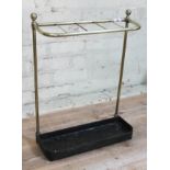 A late Victorian brass stick and umbrella stand with cast iron base, height 57cm.