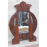 An Arts & Crafts style carved oak framed mirror, circa 1900, 33cm x 53cm.