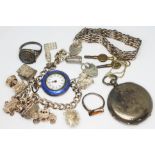 A mixed lot of silver comprising a hallmarked silver charm bracelet, a hallmarked silver ring and