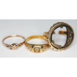 A hallmarked 18ct gold ring set with two diamonds wt. 5.94g and two hallmarked 9ct gold rings wt.