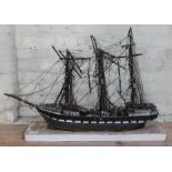 A 19th century wooden model galleon, length 94cm. In need of some restoration.