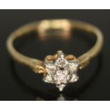 A diamond cluster ring, head diam. approx. 7mm, band unmarked, gross wt. 2.42g, size P/Q.