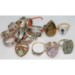 A mixed lot of gold, silver, yellow and white metal rings including one set with an oval mixed cut