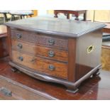 An Edwardian bow front mahogany canteen chest in the Chippendale style with carved 'frieze'