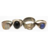 Two hallmarked silver rings, one set with a black cabochon and the other formed as a belt buckle,