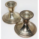 A pair of American Newport Sterling silver candlesticks, height 7.5cm.