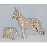 A novelty silver model dog, Mappin & Webb, London 1973, length 6cm, together with a model