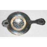 A Norwegian silver tea strainer by Magnus Aase, hallmarked 830S, length 13cm.