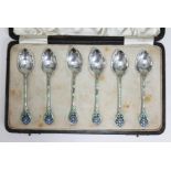 A cased set of six Art Deco silver and enamel teaspoons with flower head finials, Turner &