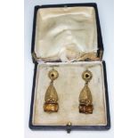 A pair of vintage yellow metal drop earrings set with orange paste, length 38mm, with box (damaged