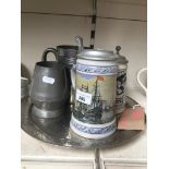 Two steins and three pieces of pewter