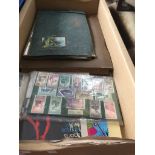A box of misc to include old photographs, stamps, etc.