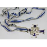 A German WWII Cross of Honour of the German Mother with blue and white ribbon.