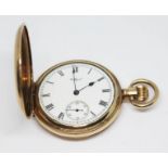 A gold plated Waltham Watch Co. pocket watch circa 1915, with Roman numerals on a signed white