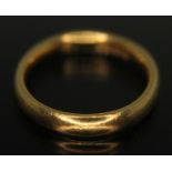 A hallmarked 22ct gold wedding band, wt. 4.90g, size K/L.