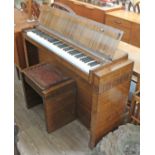 An Eavestaff "Minipiano" and matching stool.